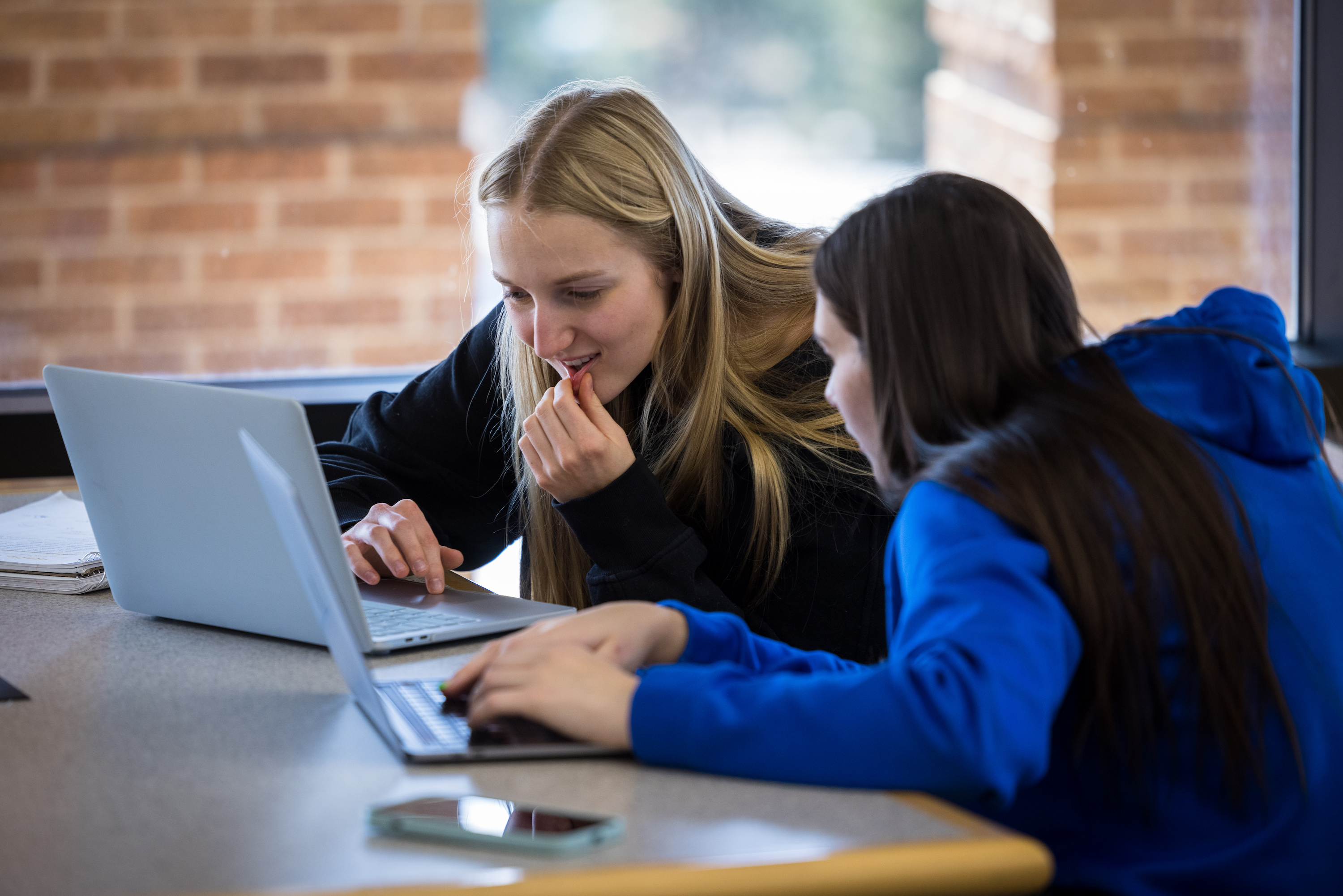 students watching videos together in the library